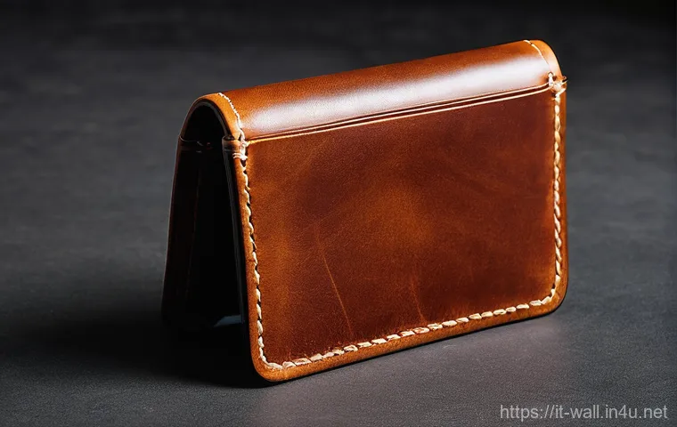 하트만 레더 지갑과 벨로 지갑 차이 - **Prompt for a Traditional Leather Wallet:**
    "A close-up, warm-toned photograph capturing the es...